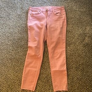 Faded red denim ankle jeans